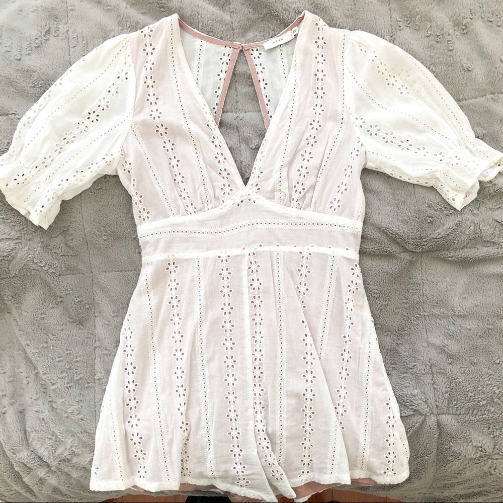 Lush delicate white romper with puff sleeve